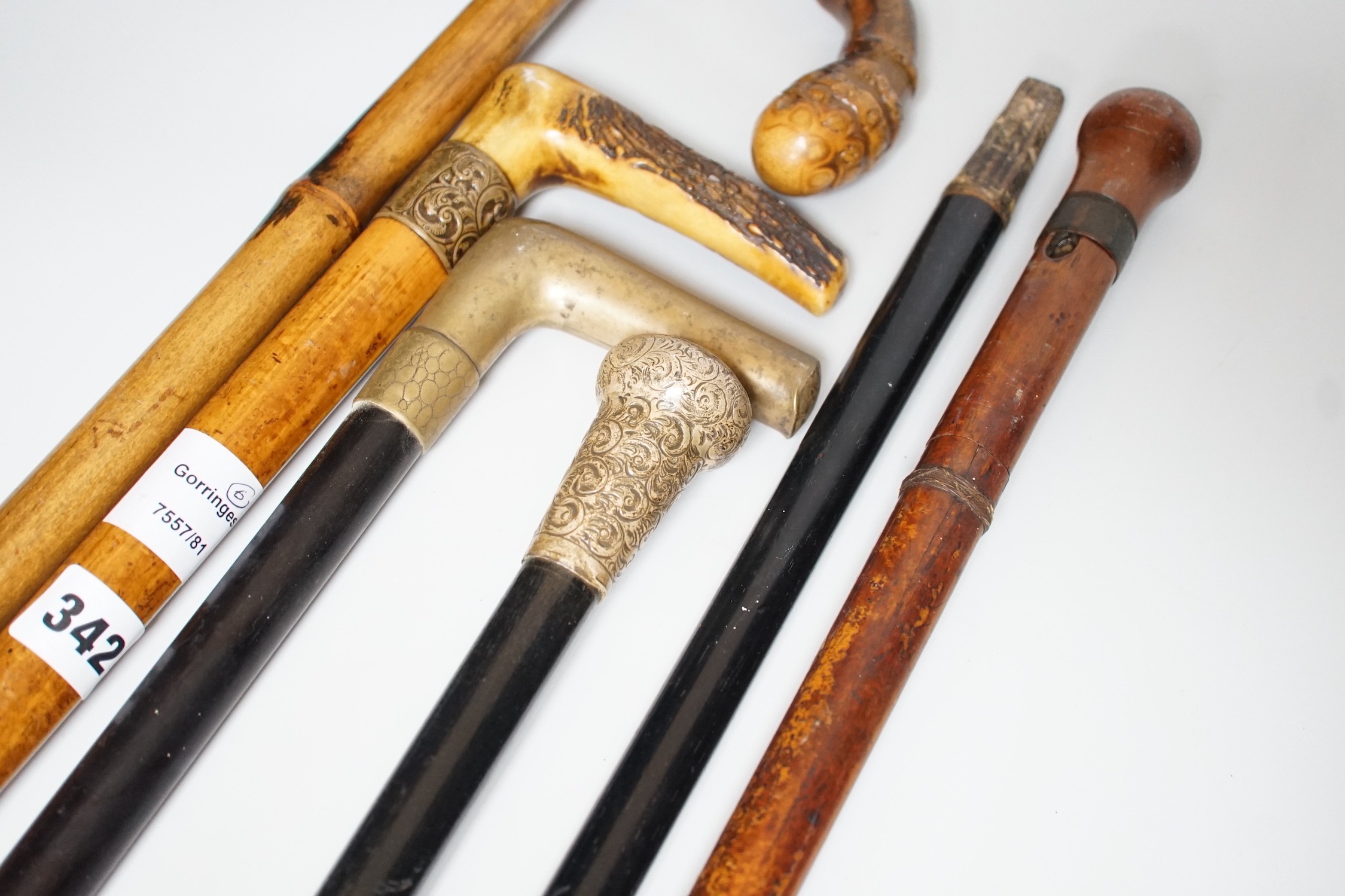 Two Victorian silver mounted walking sticks, a sword stick and three other sticks (6)